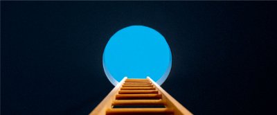 Looking up at a ladder leaning against a hole showing a blue sky