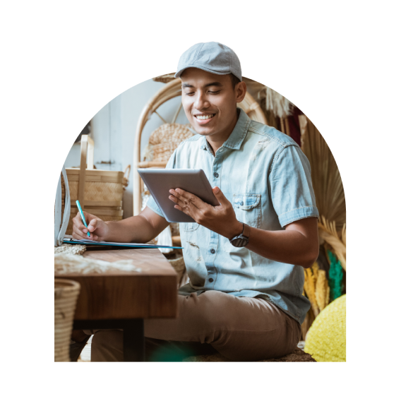 A man taking notes with tablet in hand