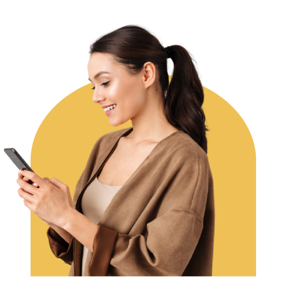 A woman looking at phone screen with a smile