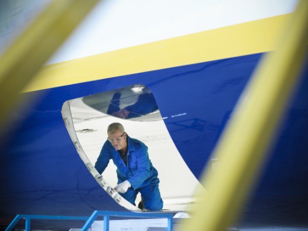 Worker outside an aircraft fuselage