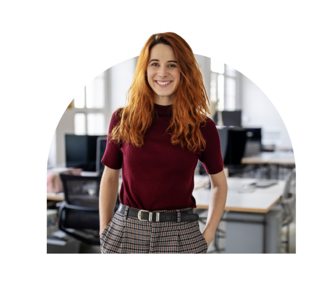 A young woman with a smile on her face in a red office attire at work