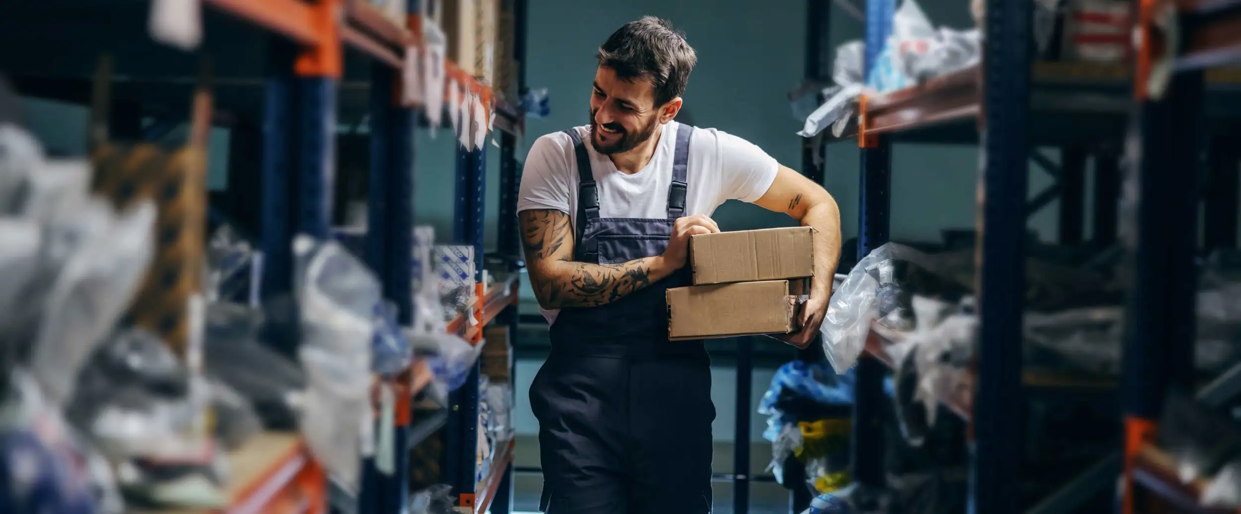 A warehouse employee stocking items on the shelf