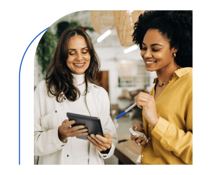 Picture of two women looking at tablet screen