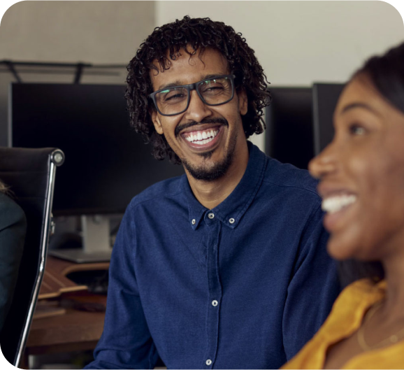 Picture of a man and a woman with the smiling face at office