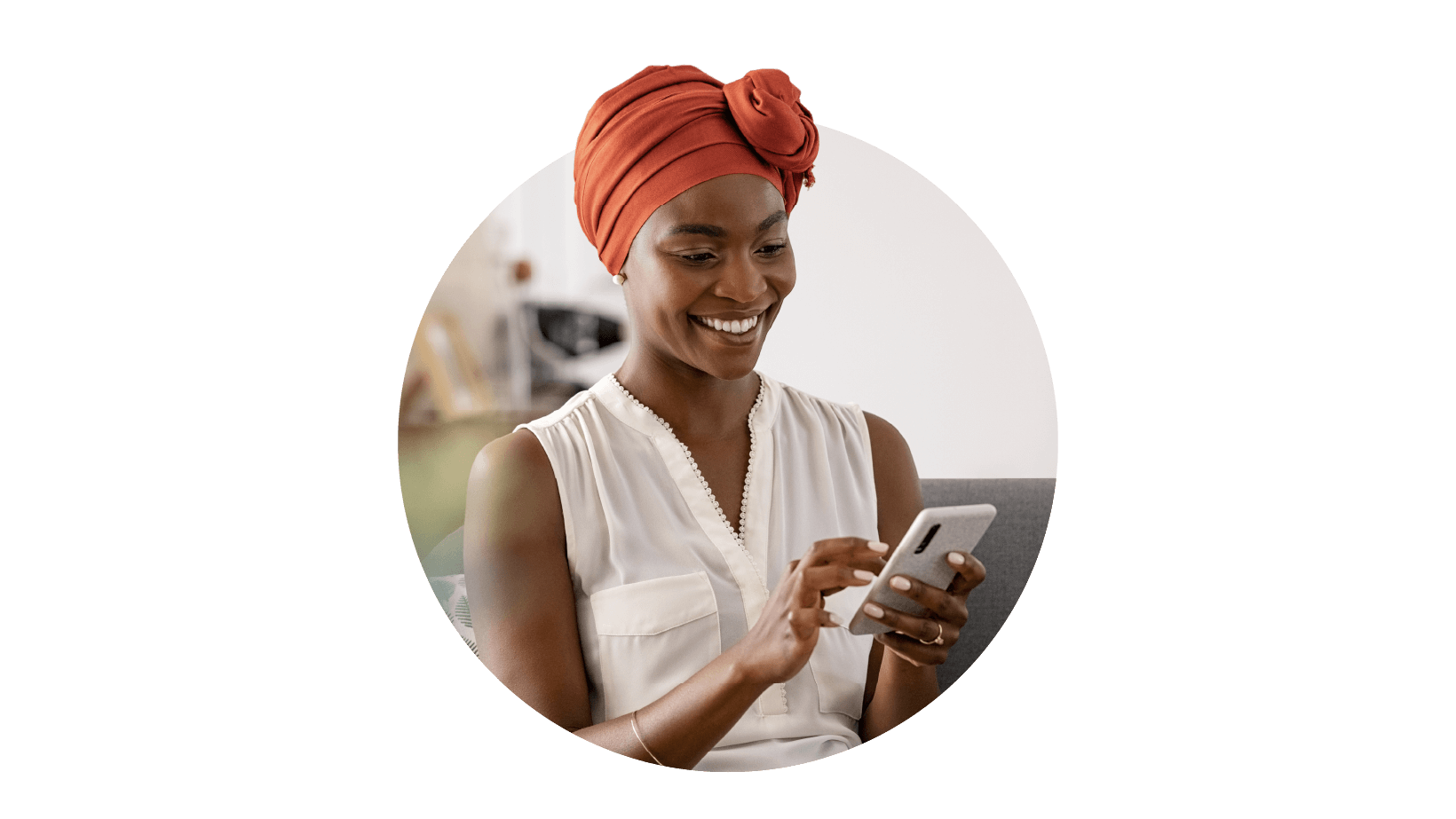 A woman looking at phone screen with a smile