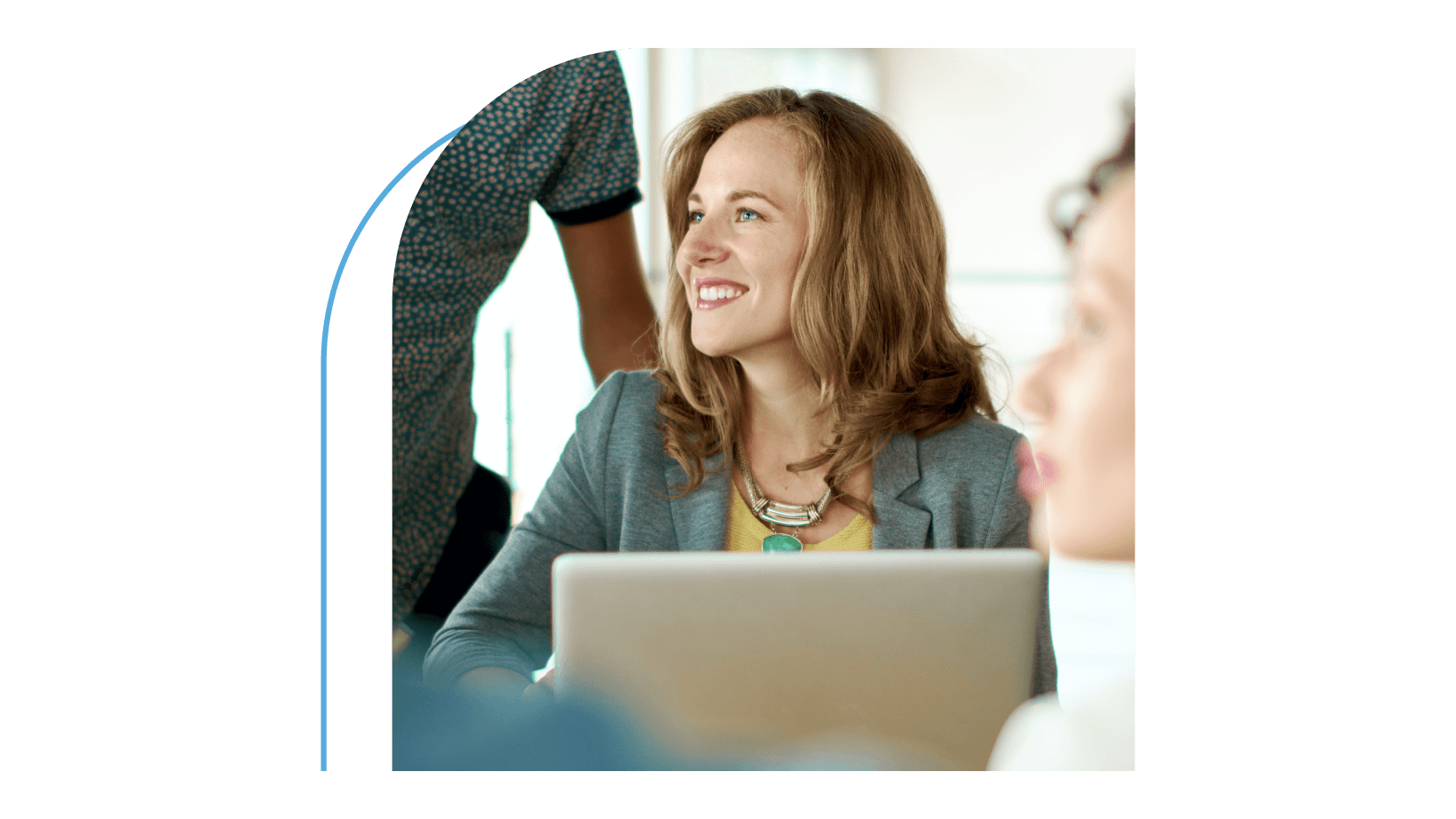 A young woman with a smiling face at office meeting