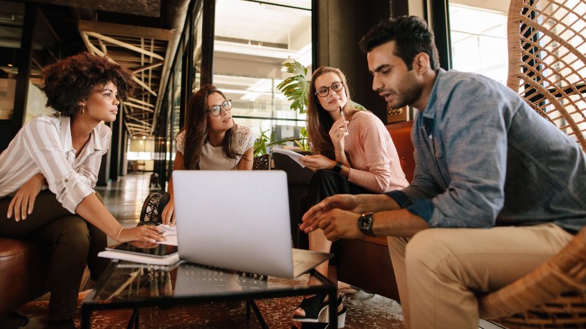 A group of young people in a business meeting