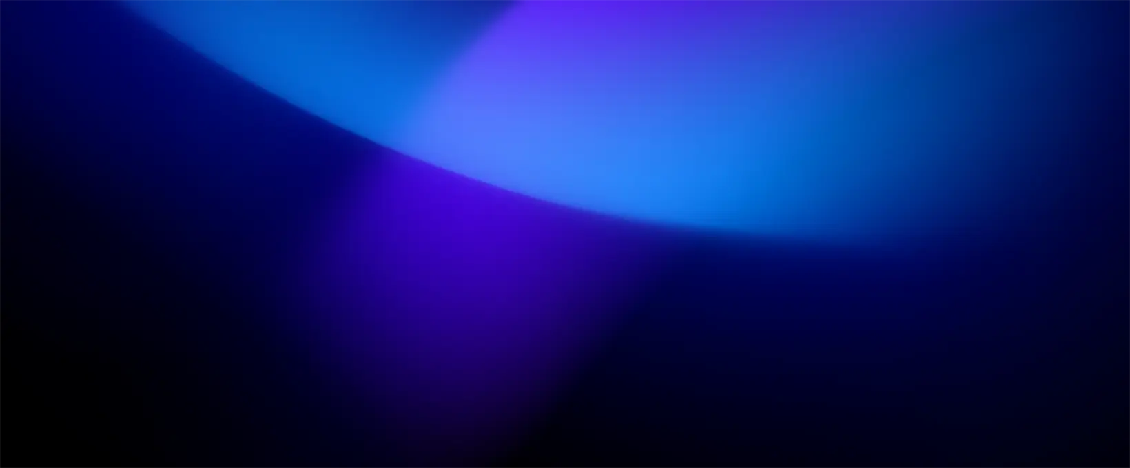 Arc of bright blue light on a dark background