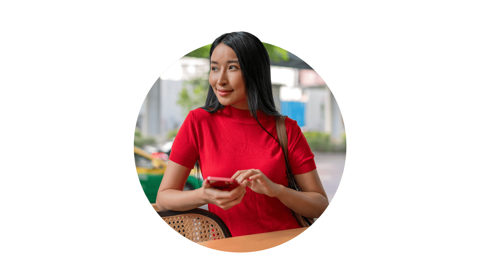 A young woman in red top with a mobile in hand