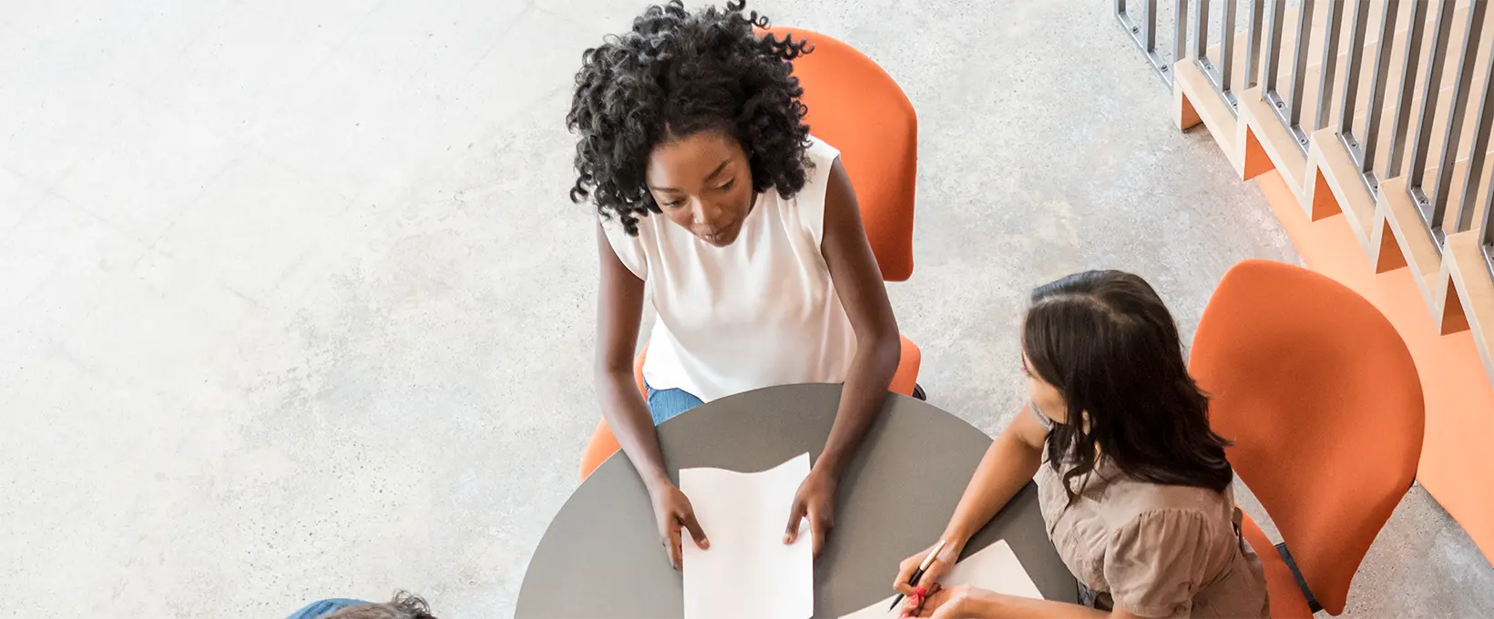 Two woman in a business meeting at round table