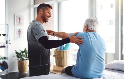 Man helping an elderly patient