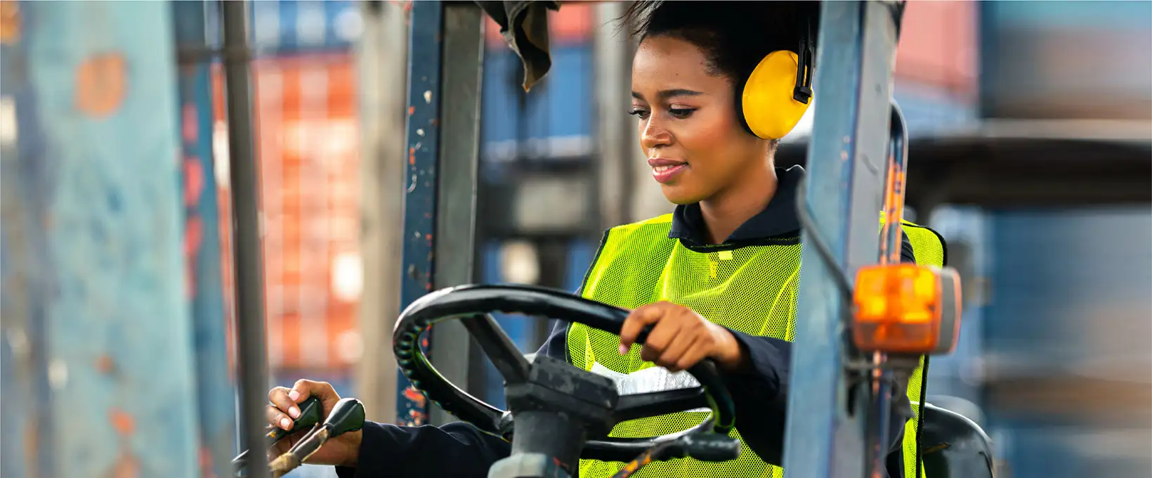 Woman driving construction equipment
